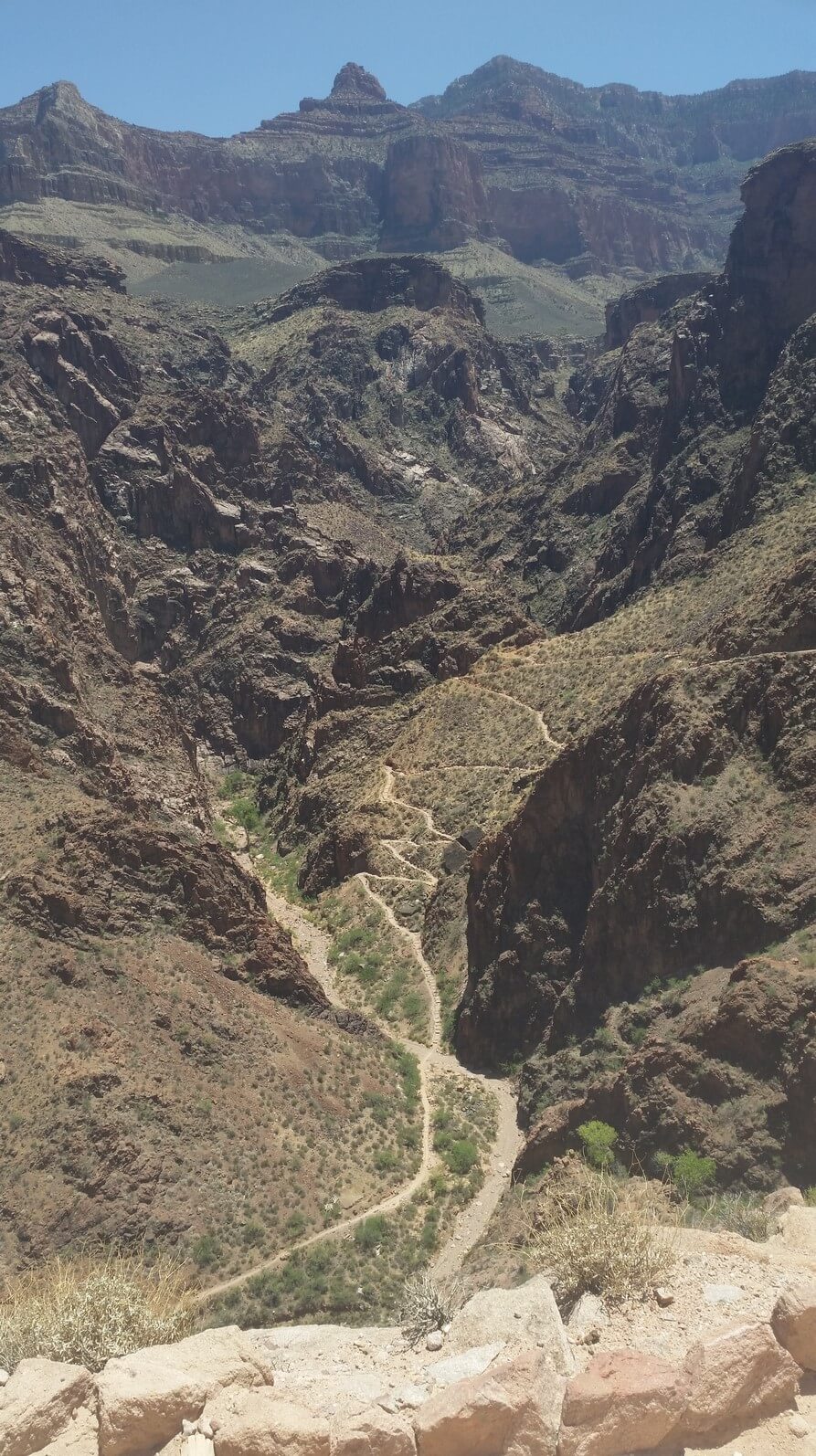 At the top. Looking down at the Devil.